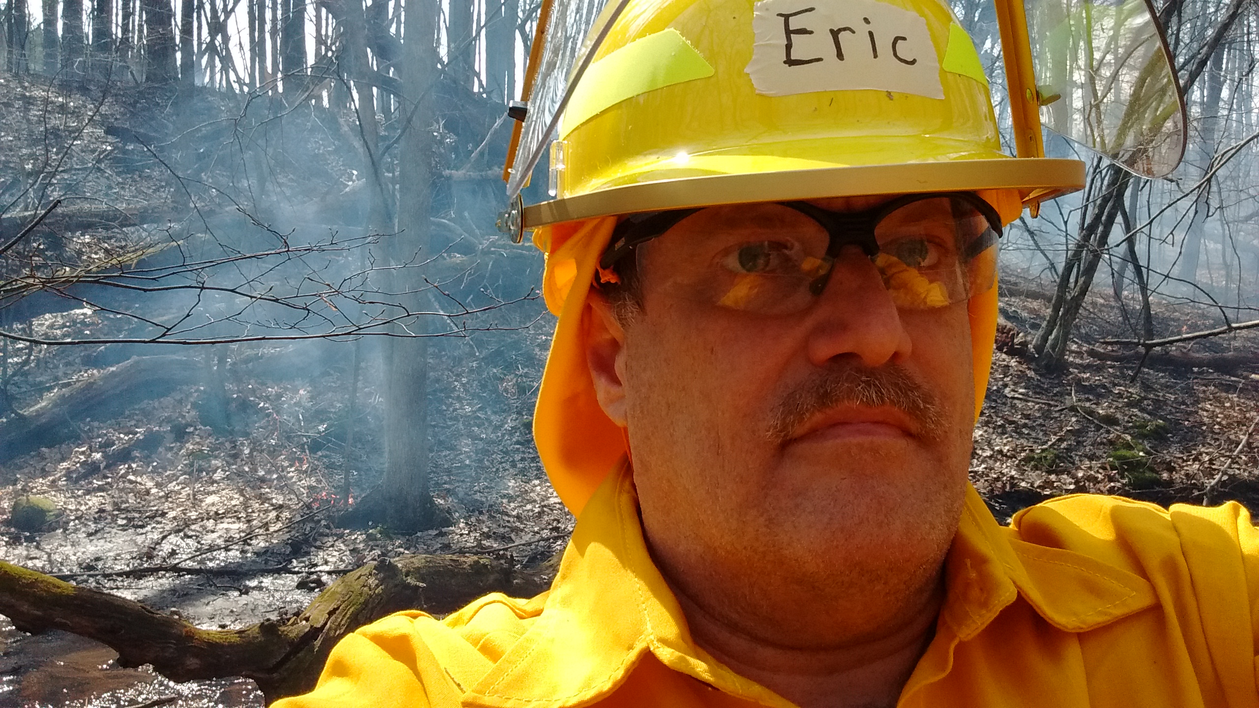 photo of author working a prescribed burn, select to view full-size